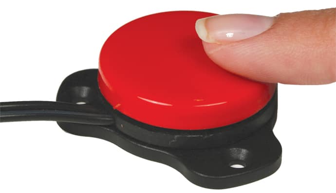 Close up of a finger pressing a gumball switch